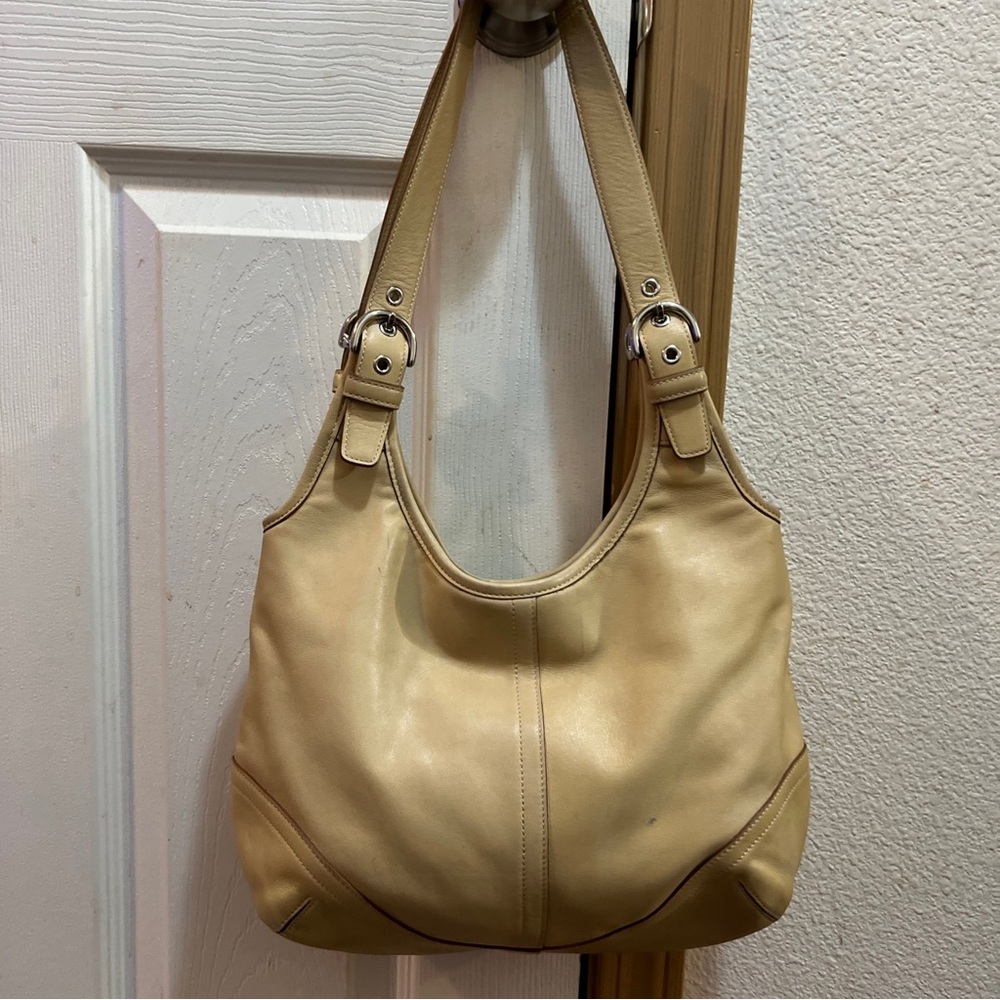 Coach Soho Slim Leather Hobo Cream Color No 9249. Bag is used.